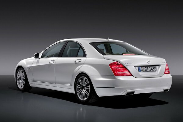 Grey car on a black background