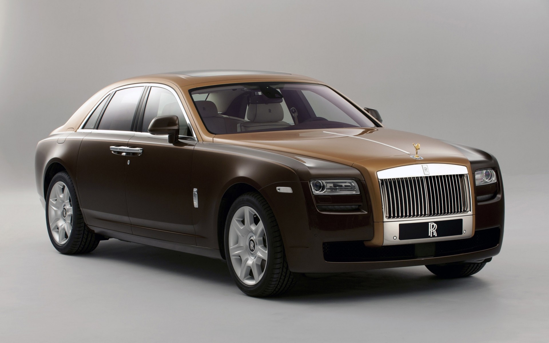 rolls royce car vehicle automotive noon wheel transportation system sedan coupe blacktop fast