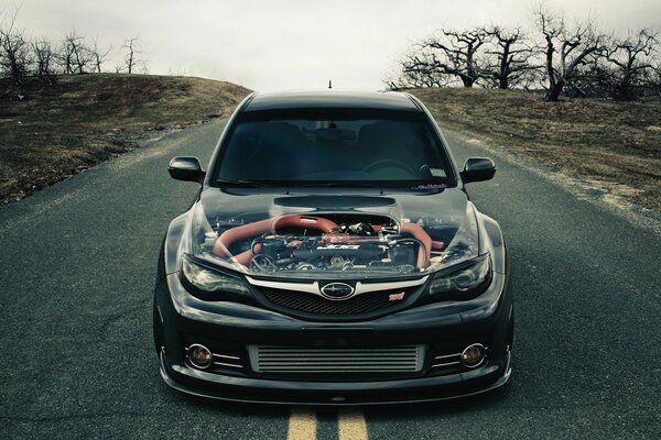 An unusual car with a transparent hood