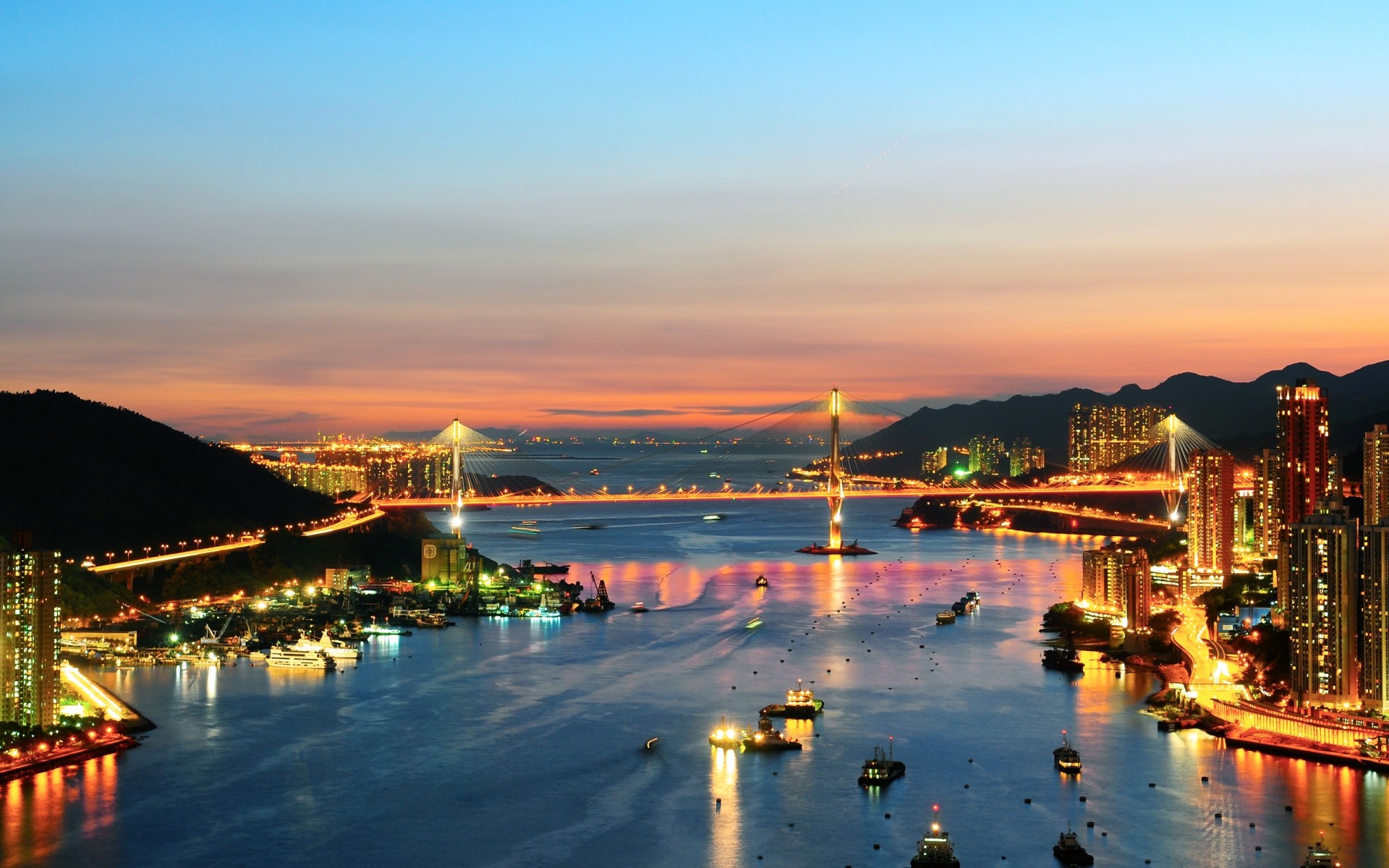 other city water travel city sunset evening architecture dusk outdoors river bridge sea building harbor transportation system sky lights boats