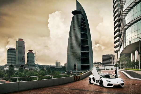 Lamborghini in the city against the backdrop of skyscrapers