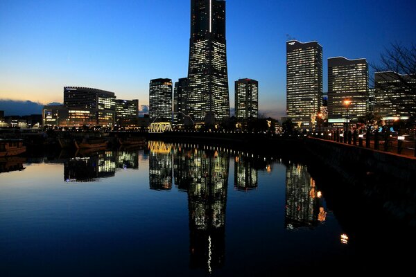 Evening city in the reflection of water