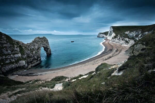 Cloudy landscape of the wild sea bay