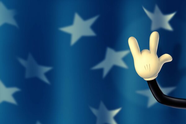 Mickey Mouse s paw on the flag background