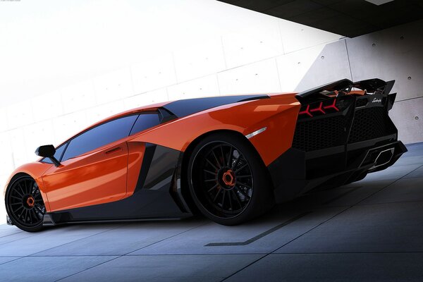 A red racing car stands on a gray floor