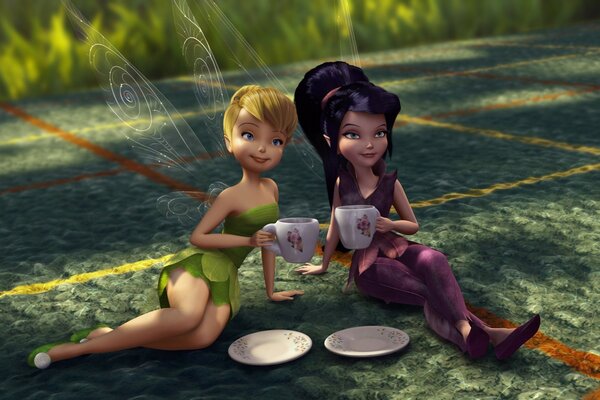 Two fairies are drinking tea.