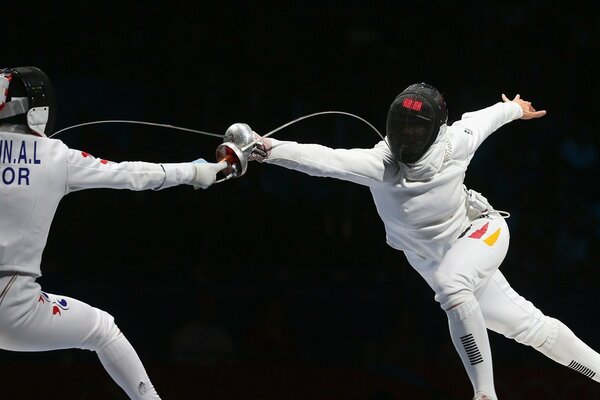 Olympic Fencing Games two shots at each other