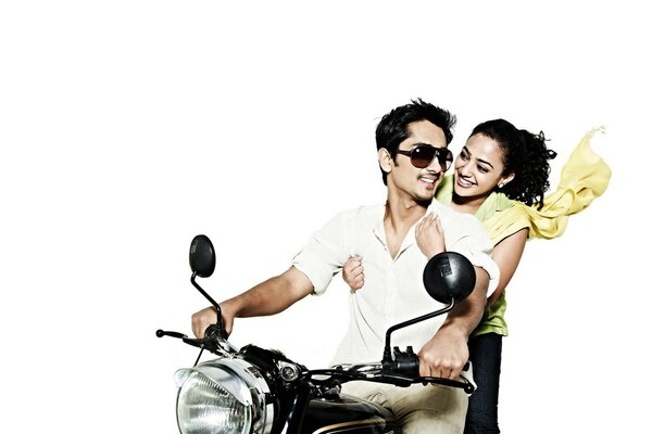 Couple on a motorcycle, on a white background