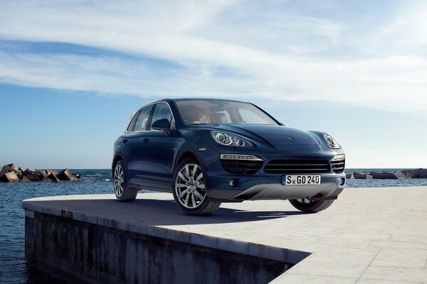 A blue Porsche arrived at the pier