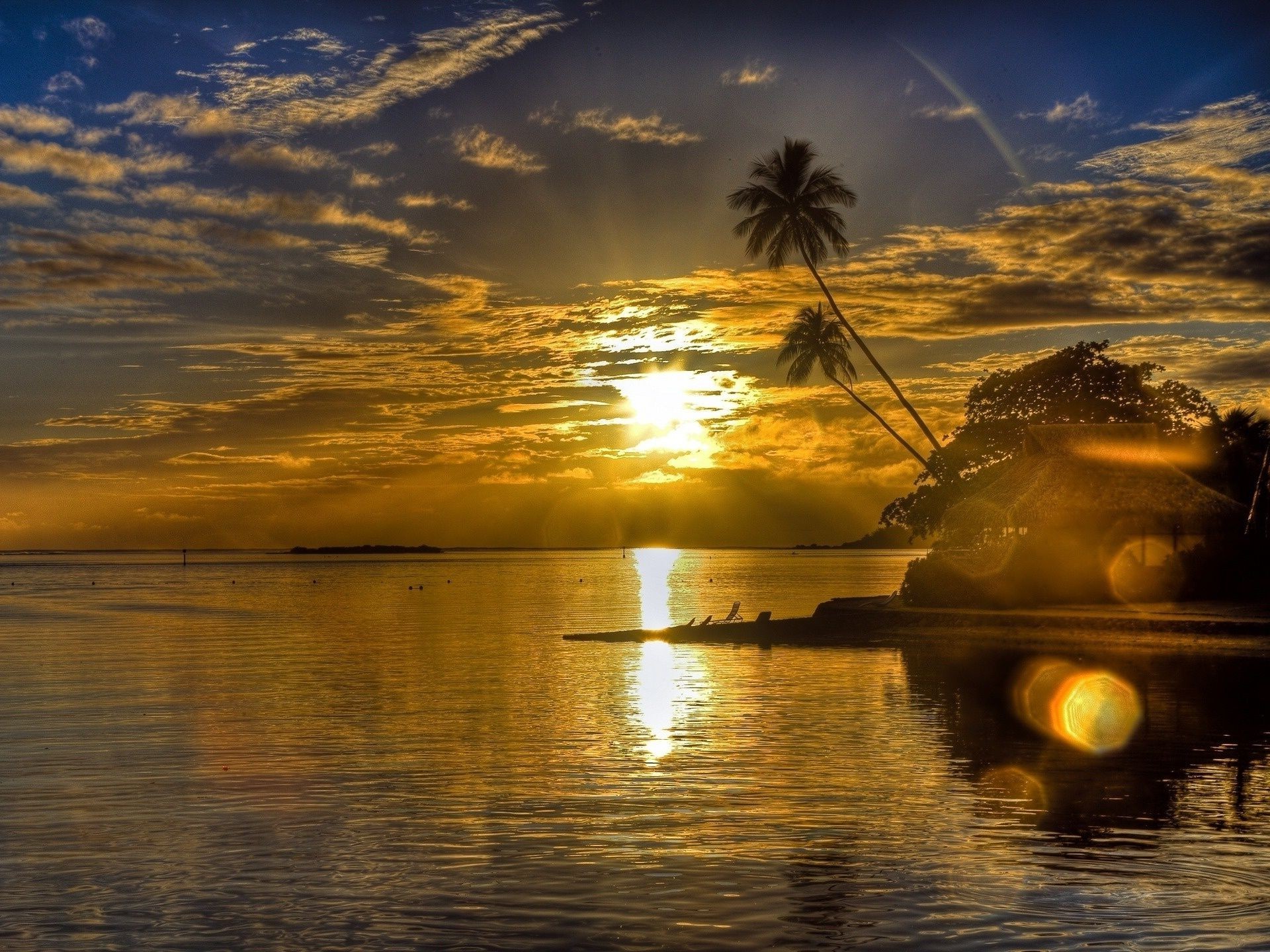 the sunset and sunrise sunset water dawn beach evening ocean sun dusk reflection sea seashore seascape travel sky tropical backlit landscape island