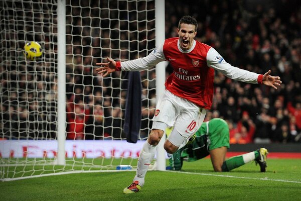 The footballer scored a goal and rejoices