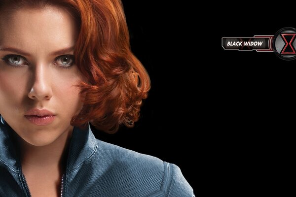 Beautiful red-haired girl on a black background