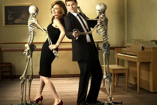 Man and woman dancing with skeletons