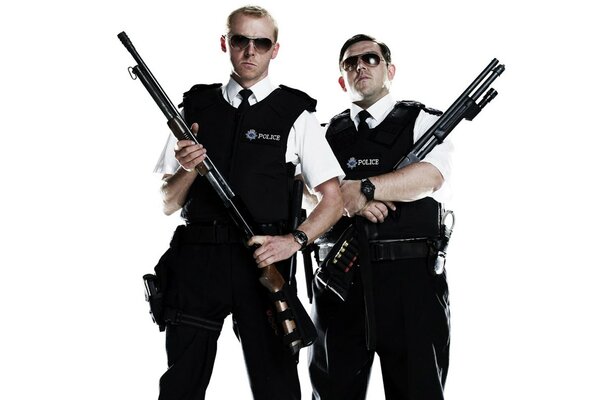 Two policemen with guns in their hands