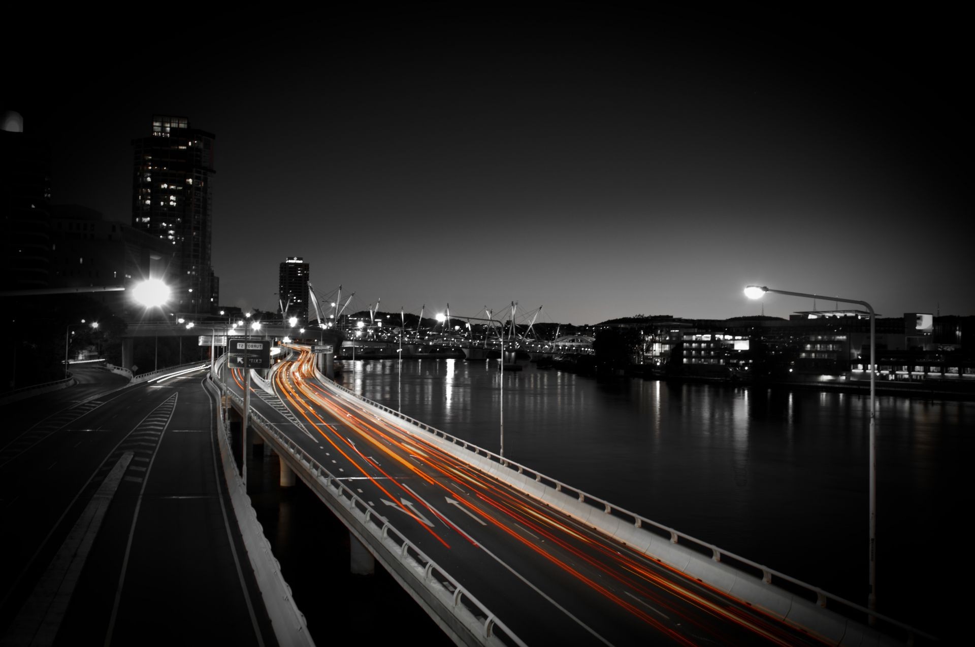 bridges bridge city evening dusk transportation system travel water street downtown road river urban reflection traffic highway architecture light building blur cityscape