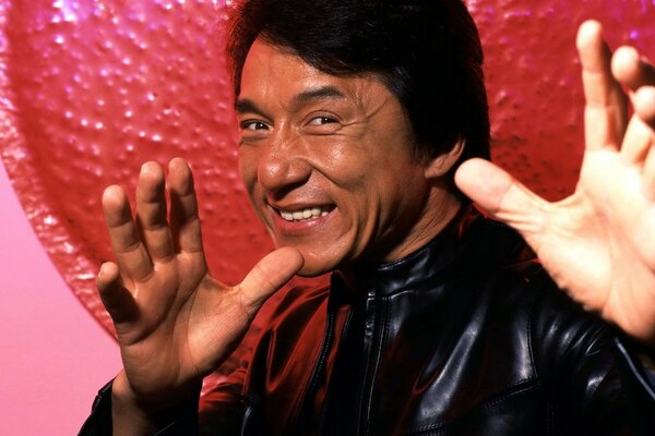 Jackie Chan poses before a blow