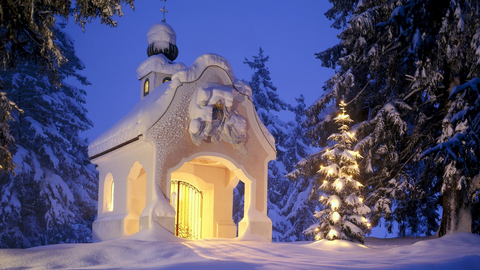 christmas architecture religion sky traditional travel cross outdoors winter church building tree gold snow wood culture