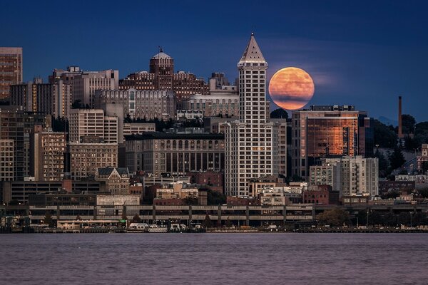 The moon in the night city of the USA