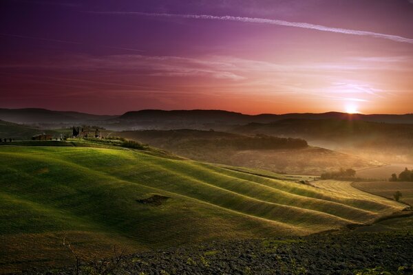 Sunset at the top of the green hills