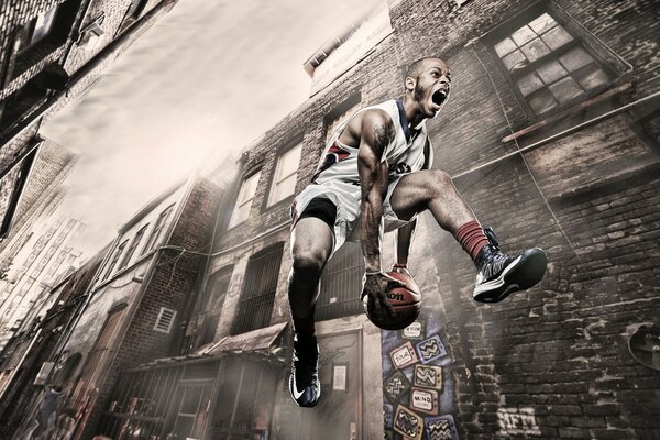 Basketball player in the jump. In the city