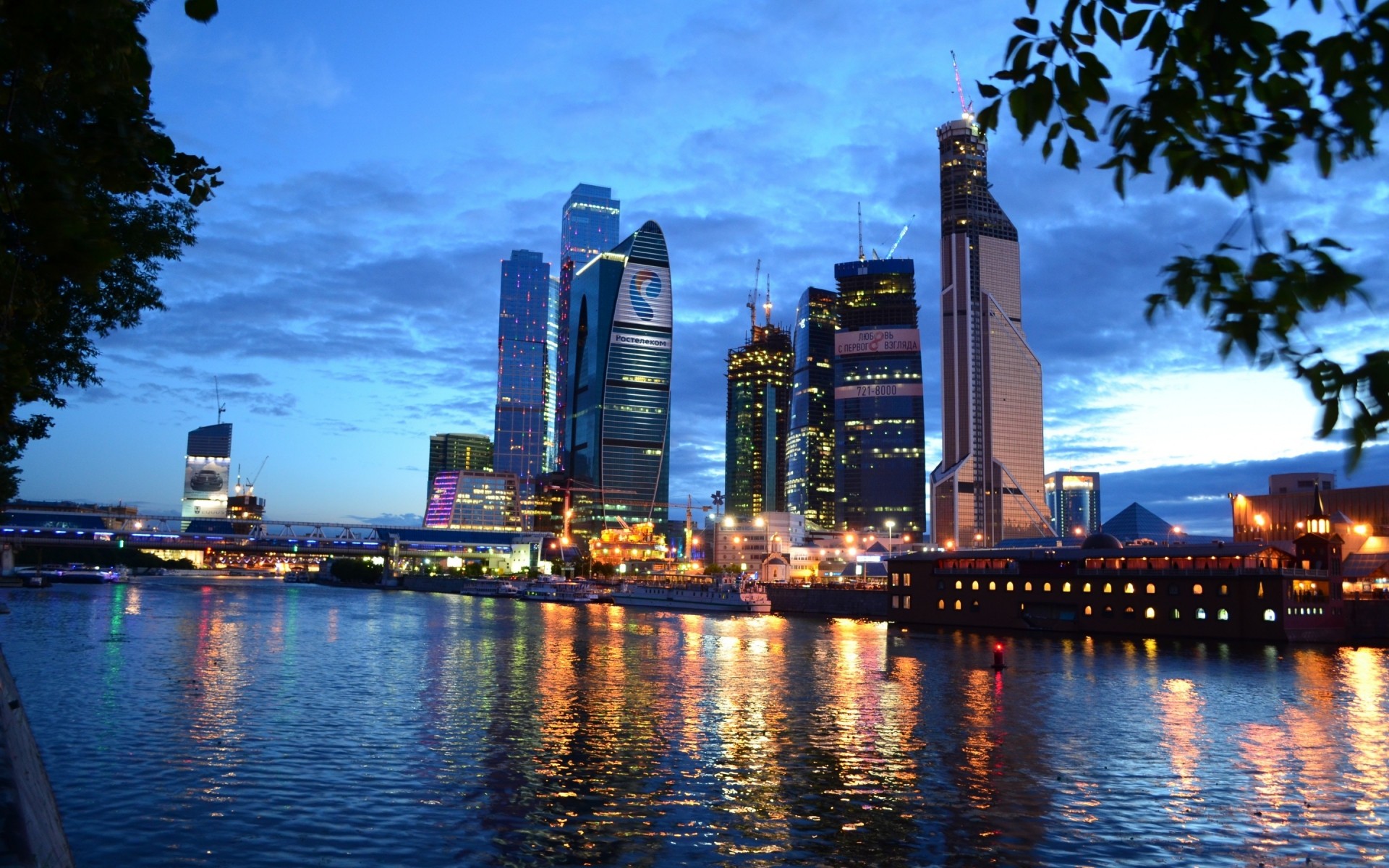 russia city architecture skyscraper cityscape skyline downtown building travel office dusk waterfront sky urban water reflection river modern tower business evening lights moscow