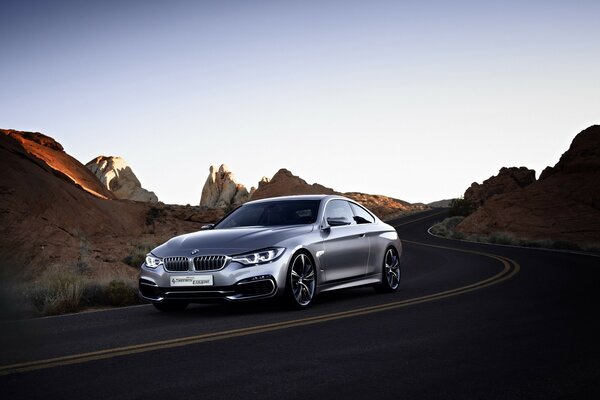 BMW concept car on the background of rocks