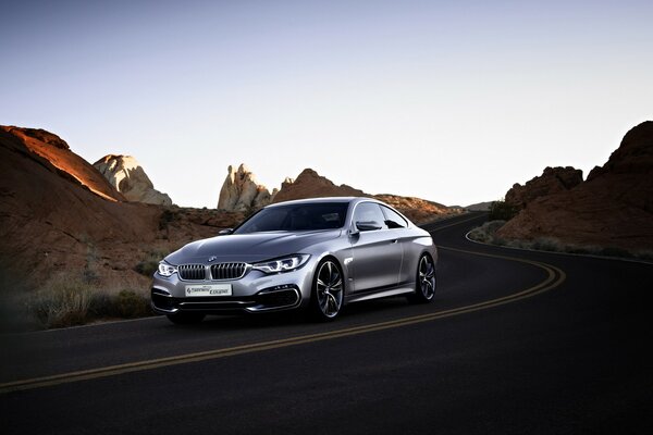 BMW concept car on the background of rocks