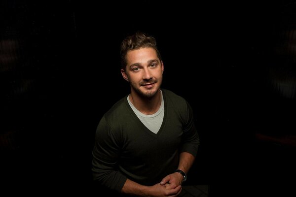 A handsome man on a dark background