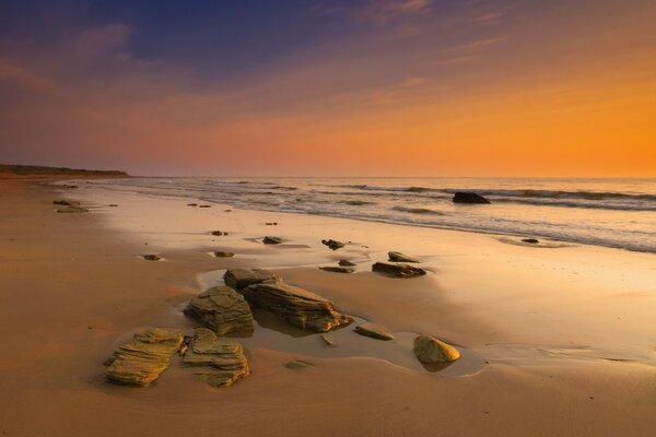 Evening beach with rocks