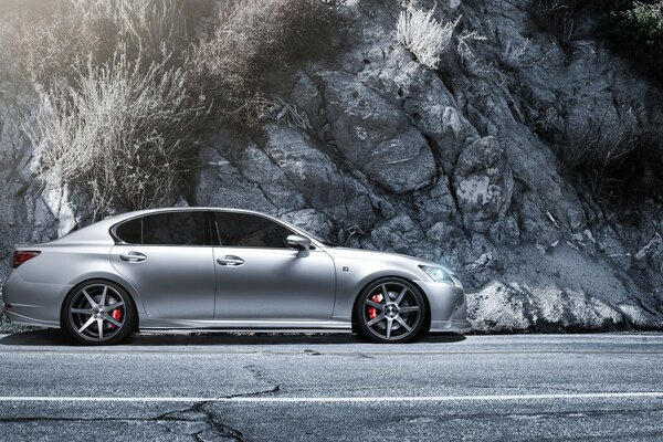 Lexus car on the road near the cliff