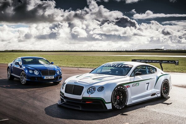 Racing cars on the autobahn. against the sky