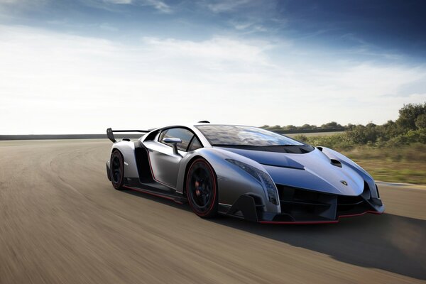 Silver Lamborghini rides on the highway