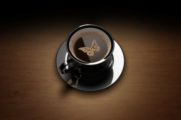 Foam butterfly in a cup of coffee