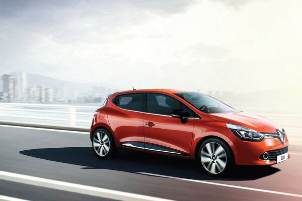 Red Renault on the road in the sun