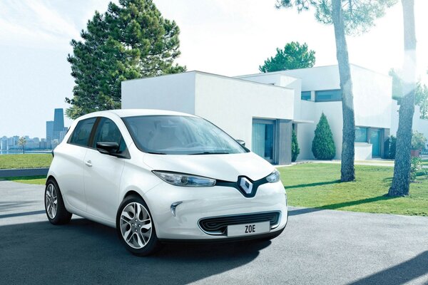 White Renault on the background of the white house