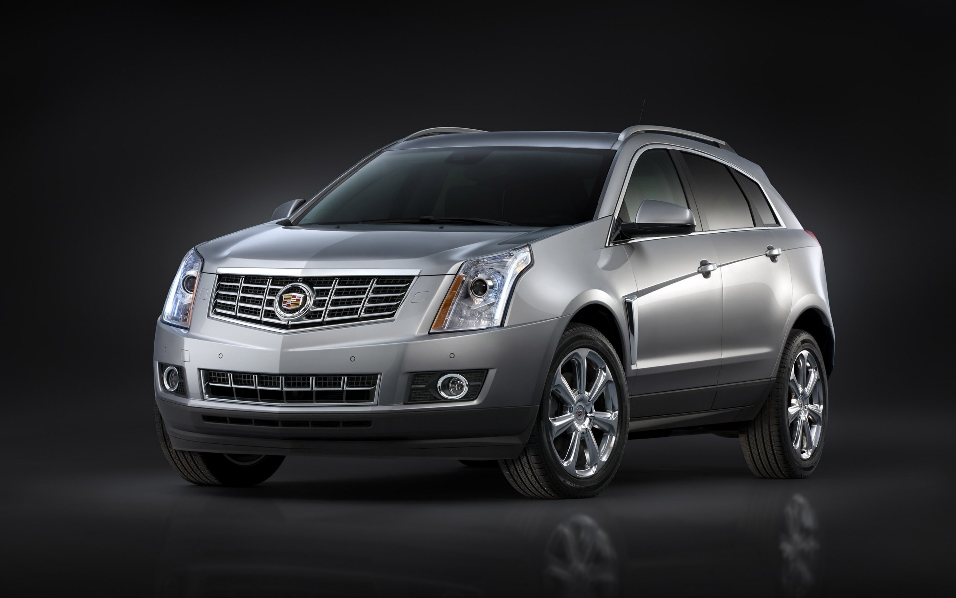 cadillac car vehicle automotive noon wheel blacktop sedan fast asphalt drive cadillac srx