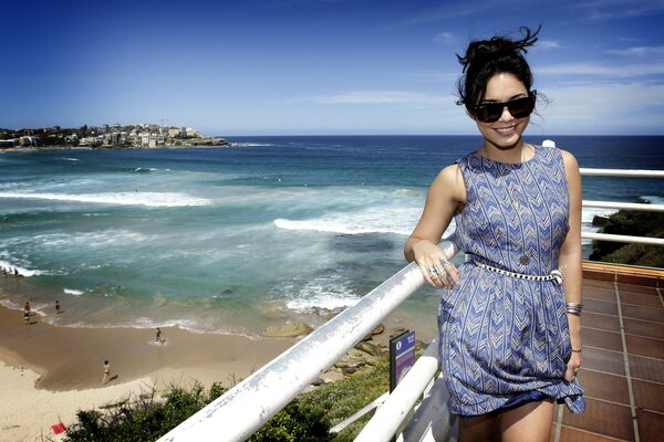 Pretty model smiles on the beach