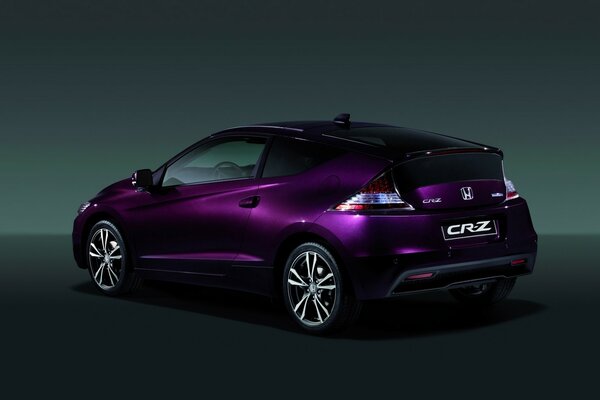 Purple Honda on a dark background