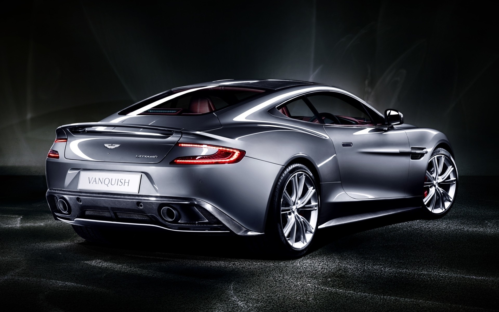 aston martin car vehicle automotive blacktop coupe noon wheel sedan fast pavement asphalt aston martin vanquish