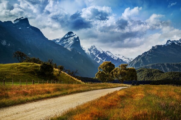 The road against the background of mountains and forests