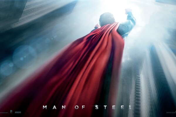 A superhero with a red cape is flying up