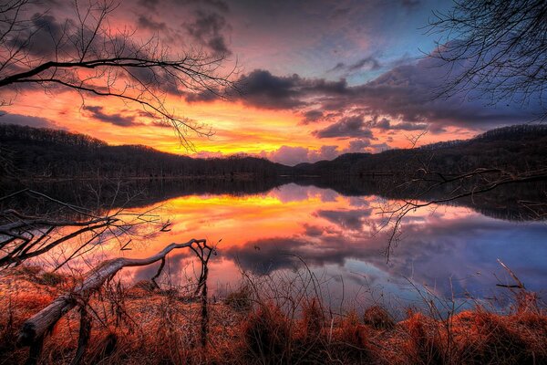 Autumn dawn with a reflection of the sky