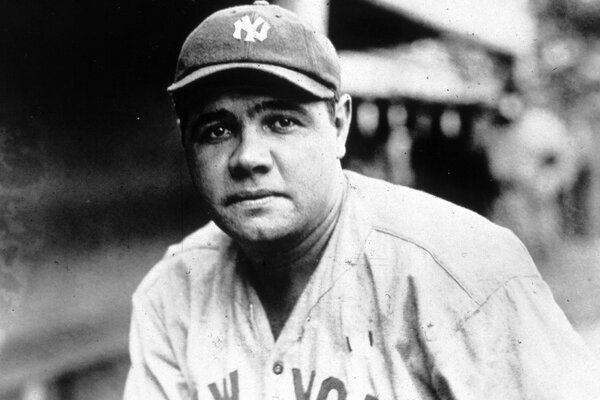 Black and white photo of a man in a baseball cap