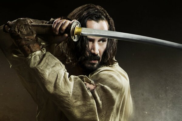 Keanu Reeves with a sword poster