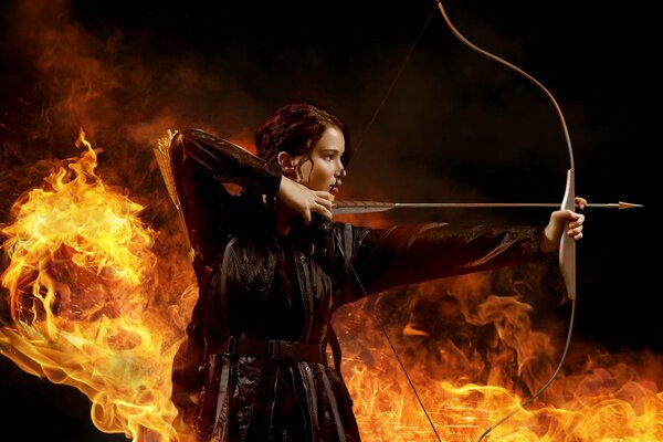 A girl with a bow on a background of fire