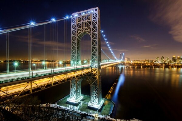 A bridge over a river connecting a city in the USA