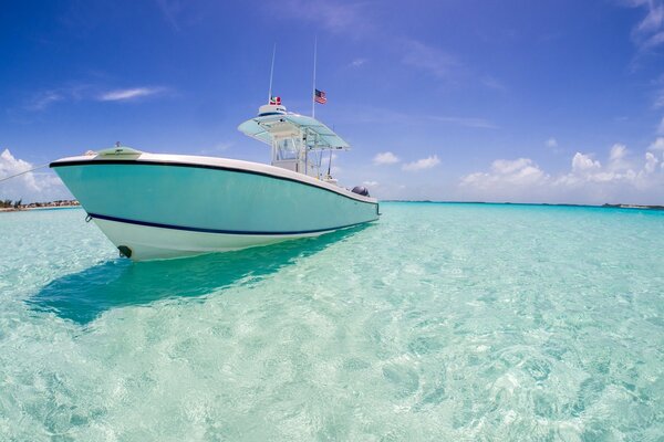 Blue sparkling water with a yacht