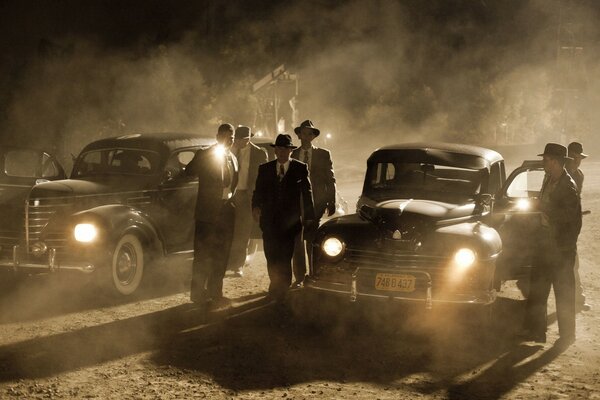 People in hats arrived in two cars