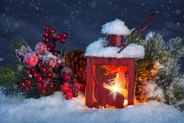 An old lantern on the ground in winter