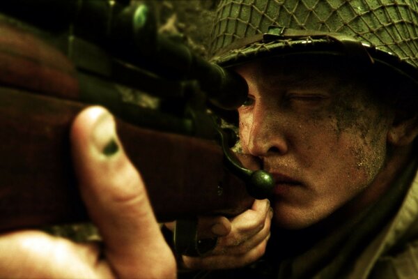 A shot from a movie where one shooter is aiming